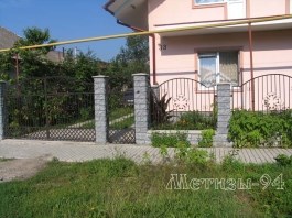 Forged fence - an excellent solution for landscape design