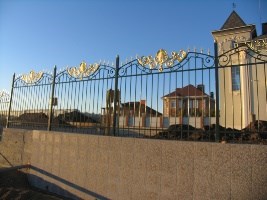 Fence made of metal pipes and stamped decor